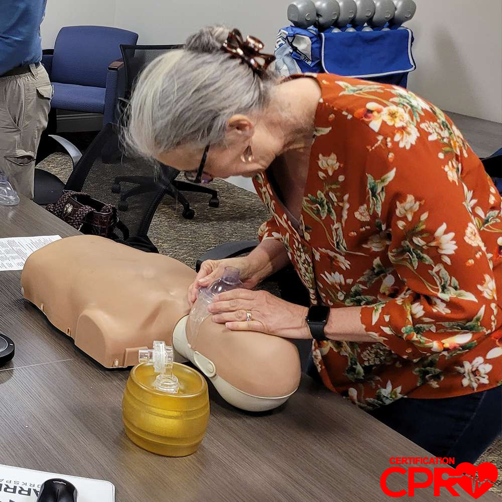 CPR training session with adult mannequin in Lakeland.