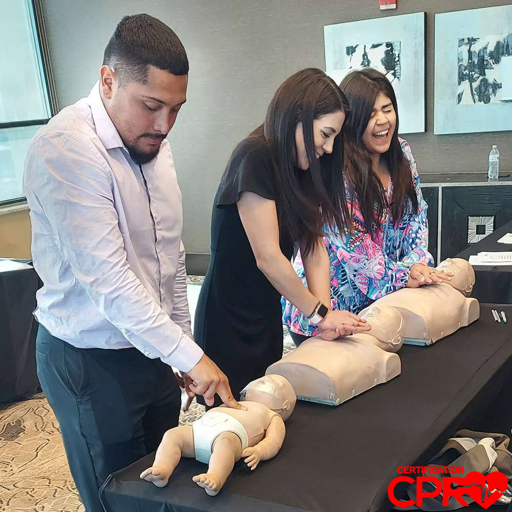 CPR training class in Lakeland with students practicing on mannequins.